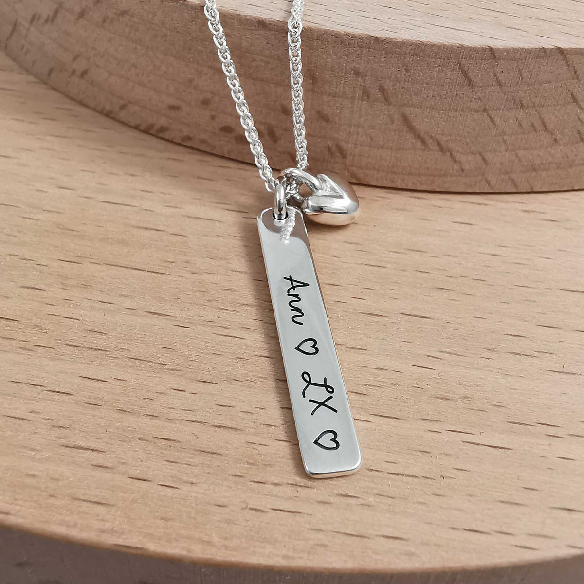 message tag pendant with heart charm