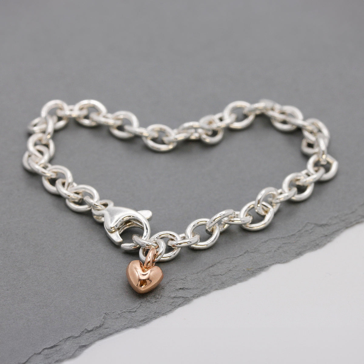 silver adjustable charm bracelet with solid rose gold heart