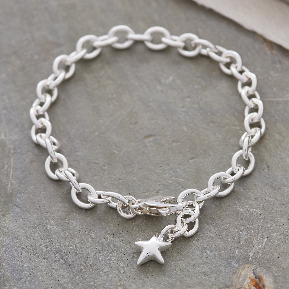 silver adjustable charm bracelet with star charm