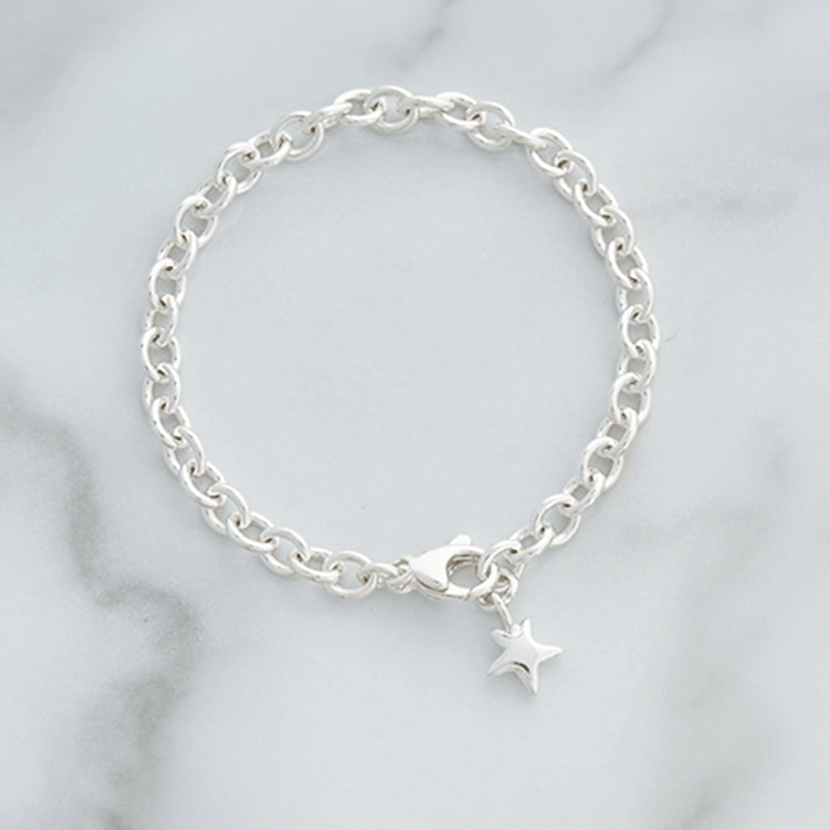 silver adjustable charm bracelet with star charm