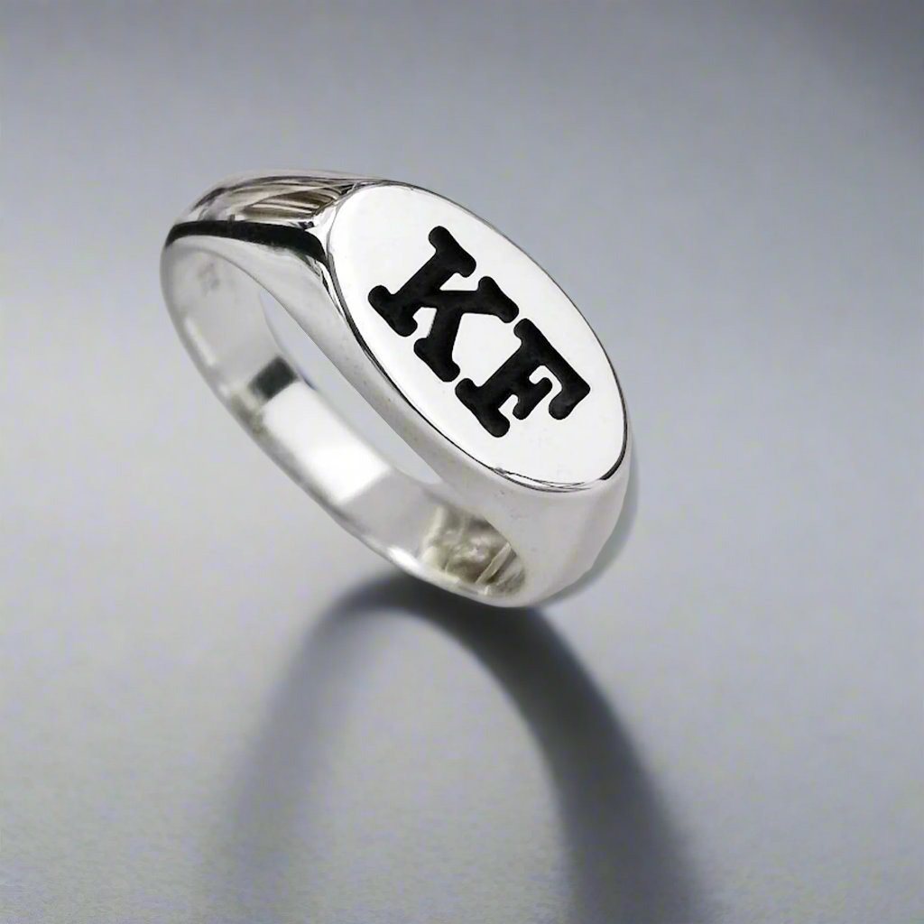 silver oval signet ring engraved with initials