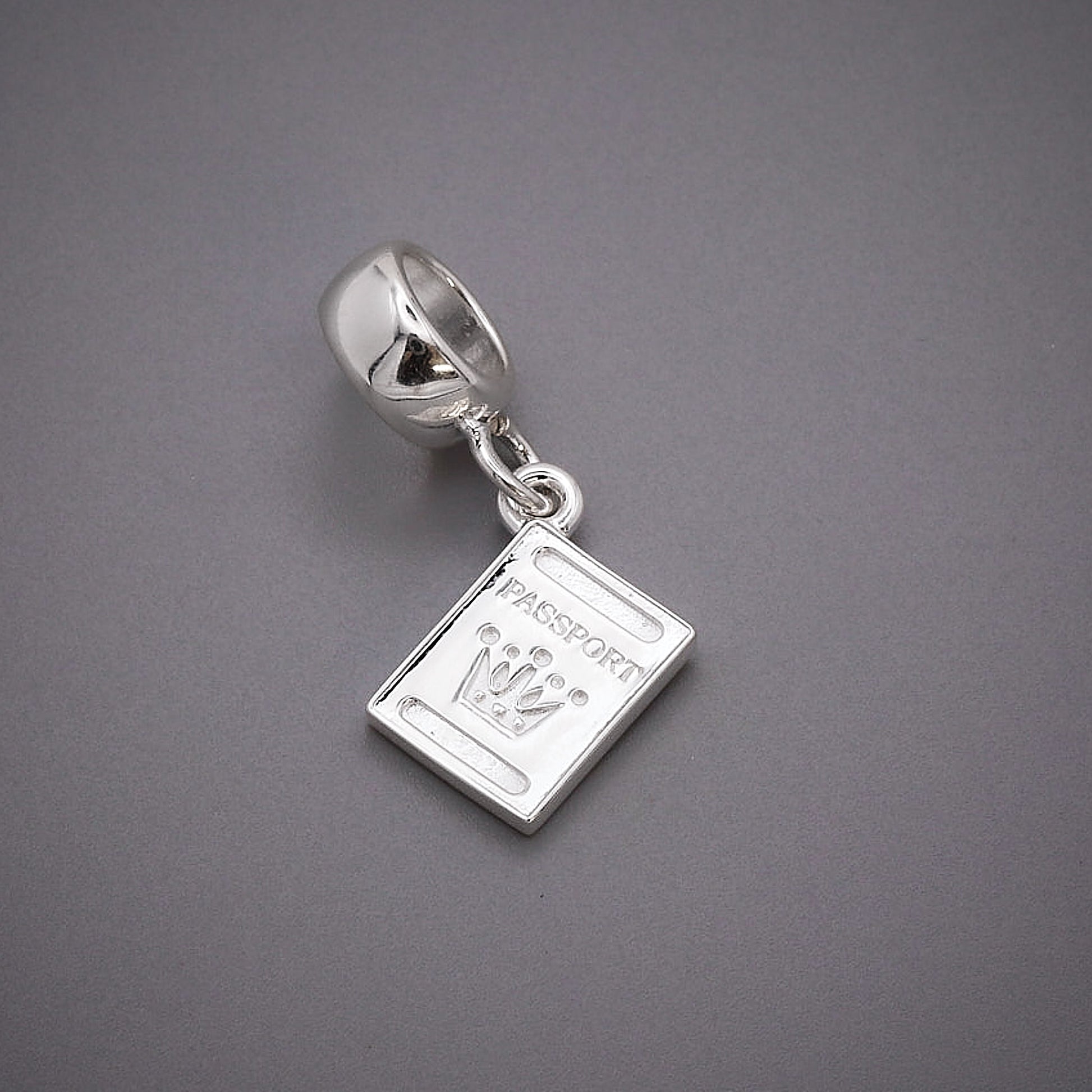 silver passport charm with pandora style charm carrier