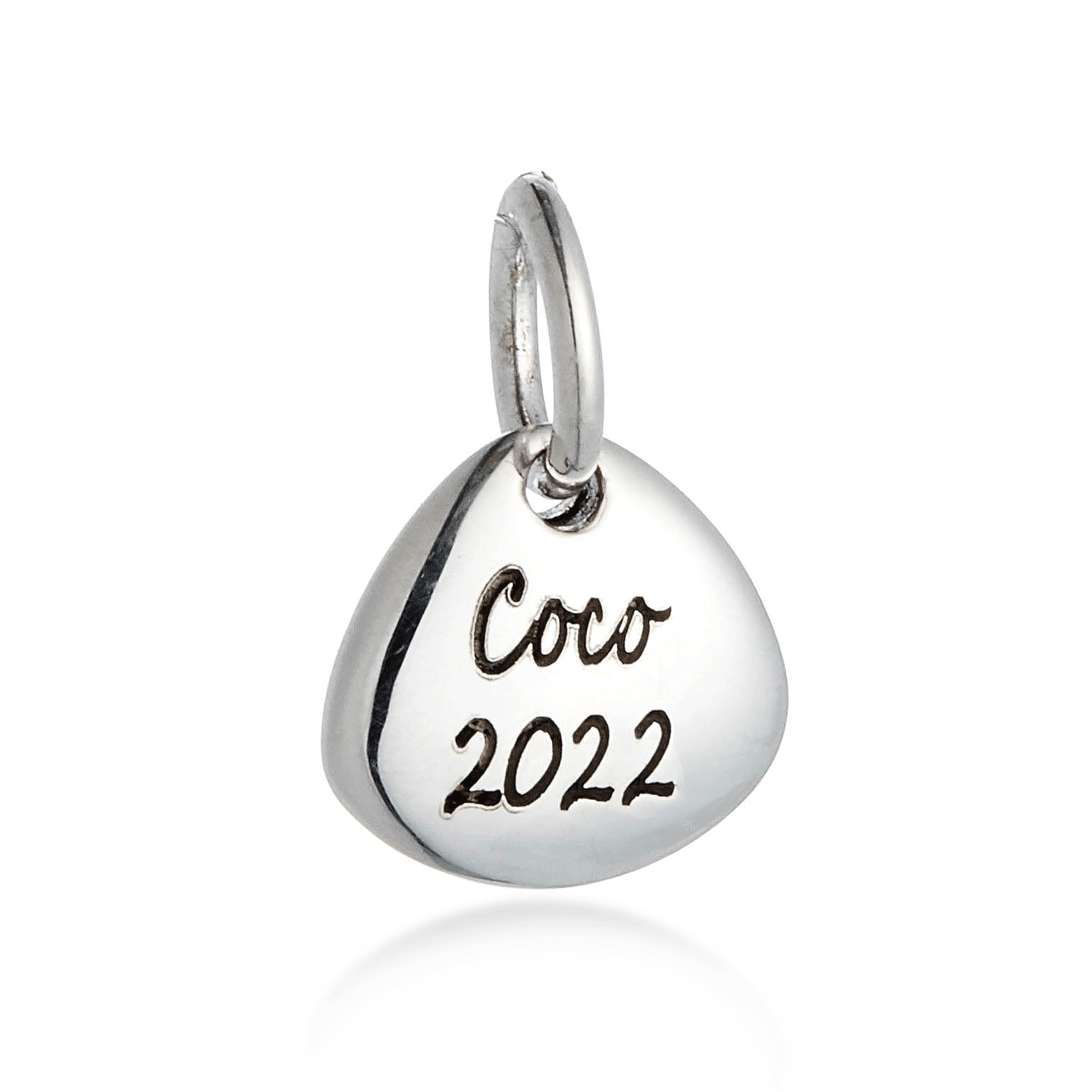 Silver pendant with 'Coco 2022' engraving on a white background