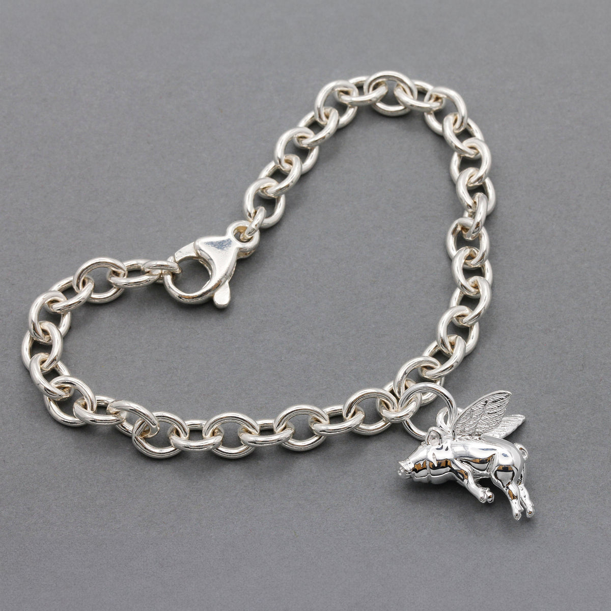 silver flying pig charm bracelet