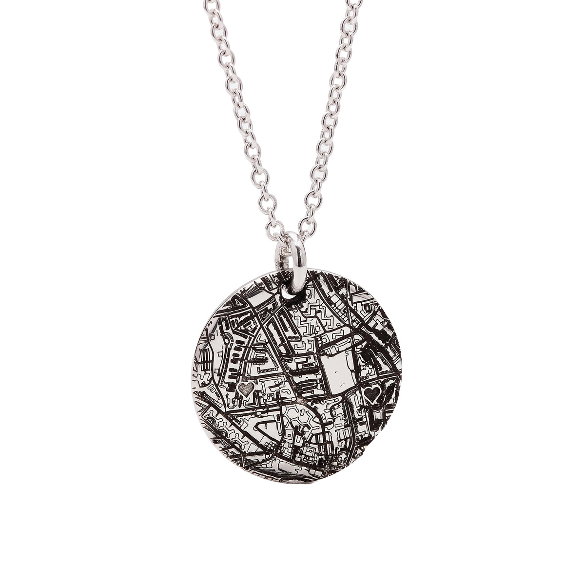 A silver chain necklace with a round pendant featuring an intricate black and white map design, shown against a plain white background.