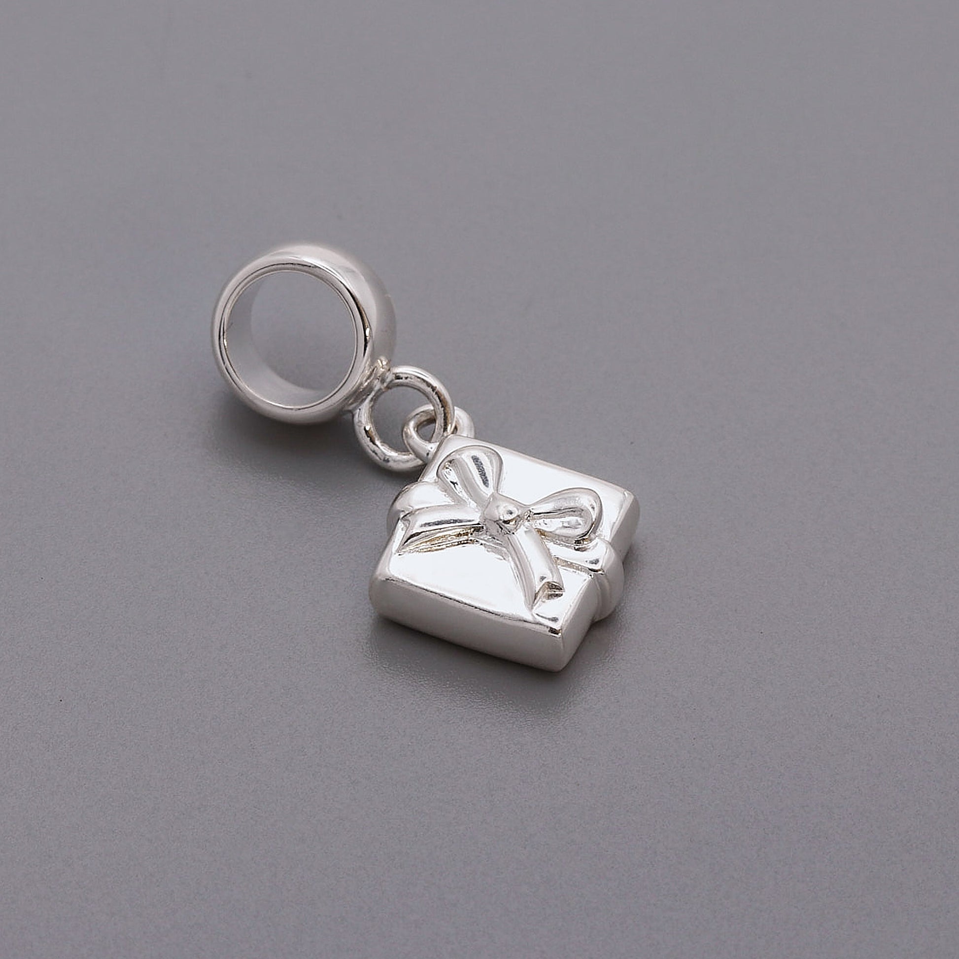 silver present with bow charm with pandora style charm carrier