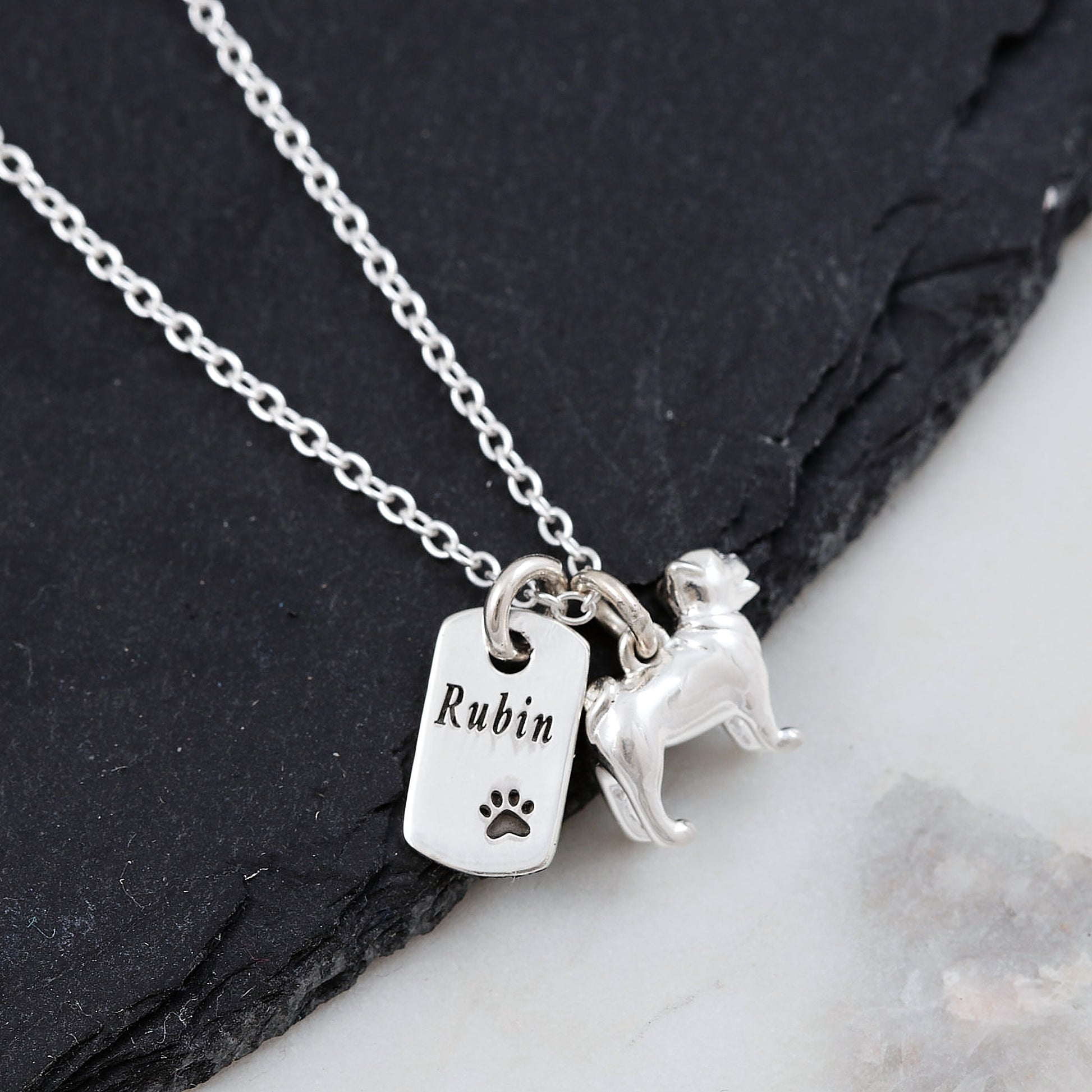 silver pug dog breed necklace with engraved name tag and paw print
