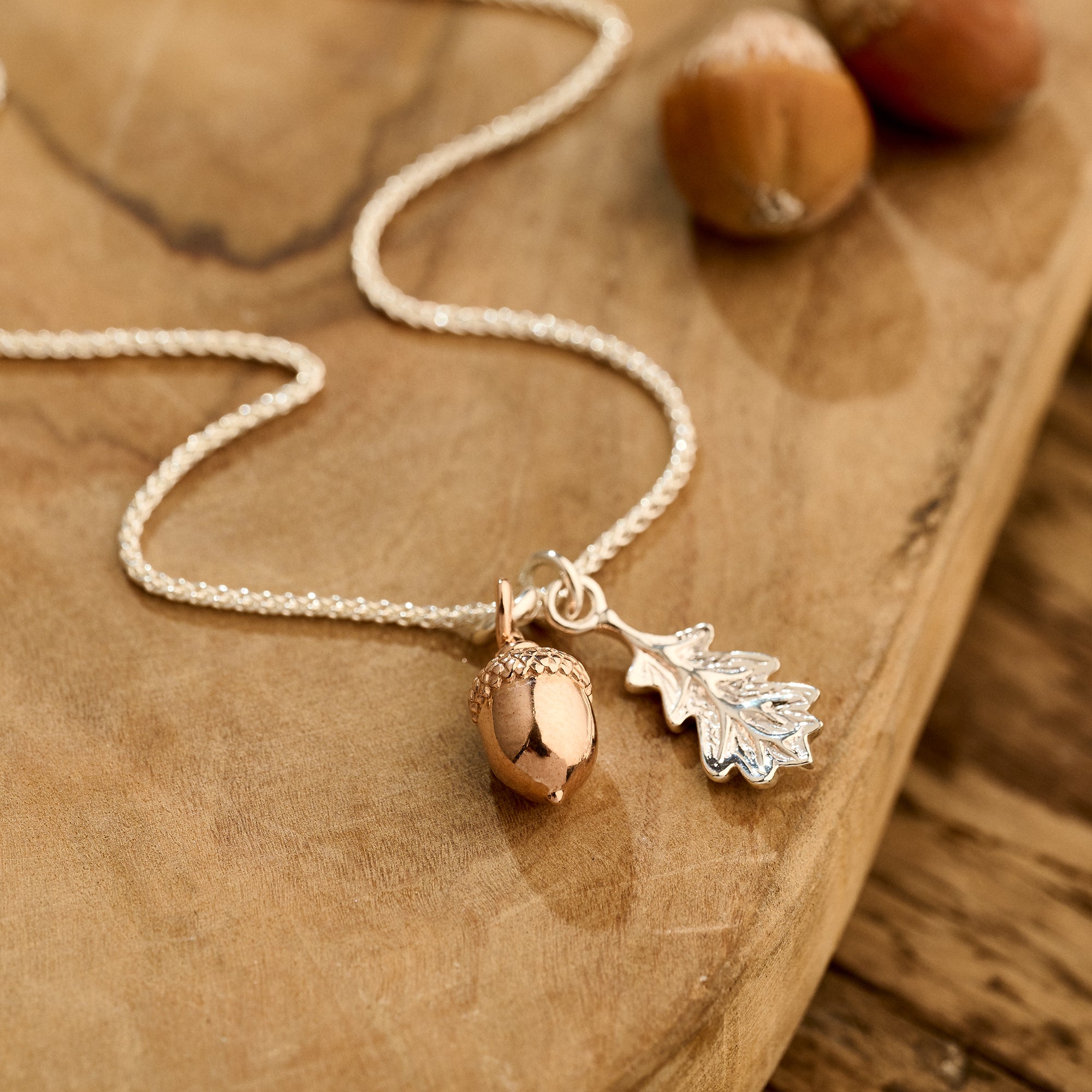 Solid Silver and Rose Gold Acorn Oak Leaf Necklace - Elegant pendant with rose gold acorn, silver oak leaf, and 1.1mm chain link. Nature-inspired luxury jewelry, crafted with precision and weighing 3.6g. Unique blend of solid silver and rose gold, a symbol of timeless beauty and craftsmanship.