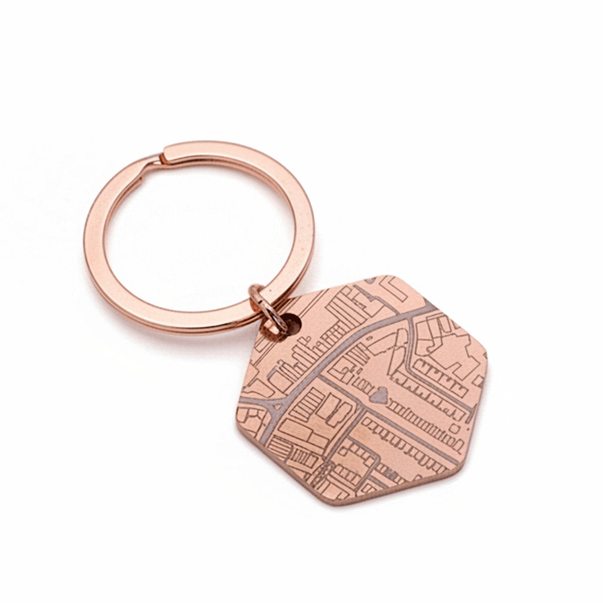Rose gold keychain with a detailed map design on a white background