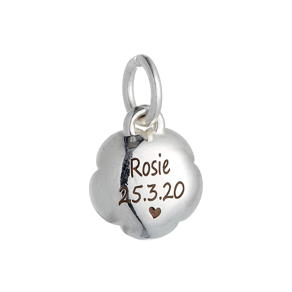 engraved back of flower charm
