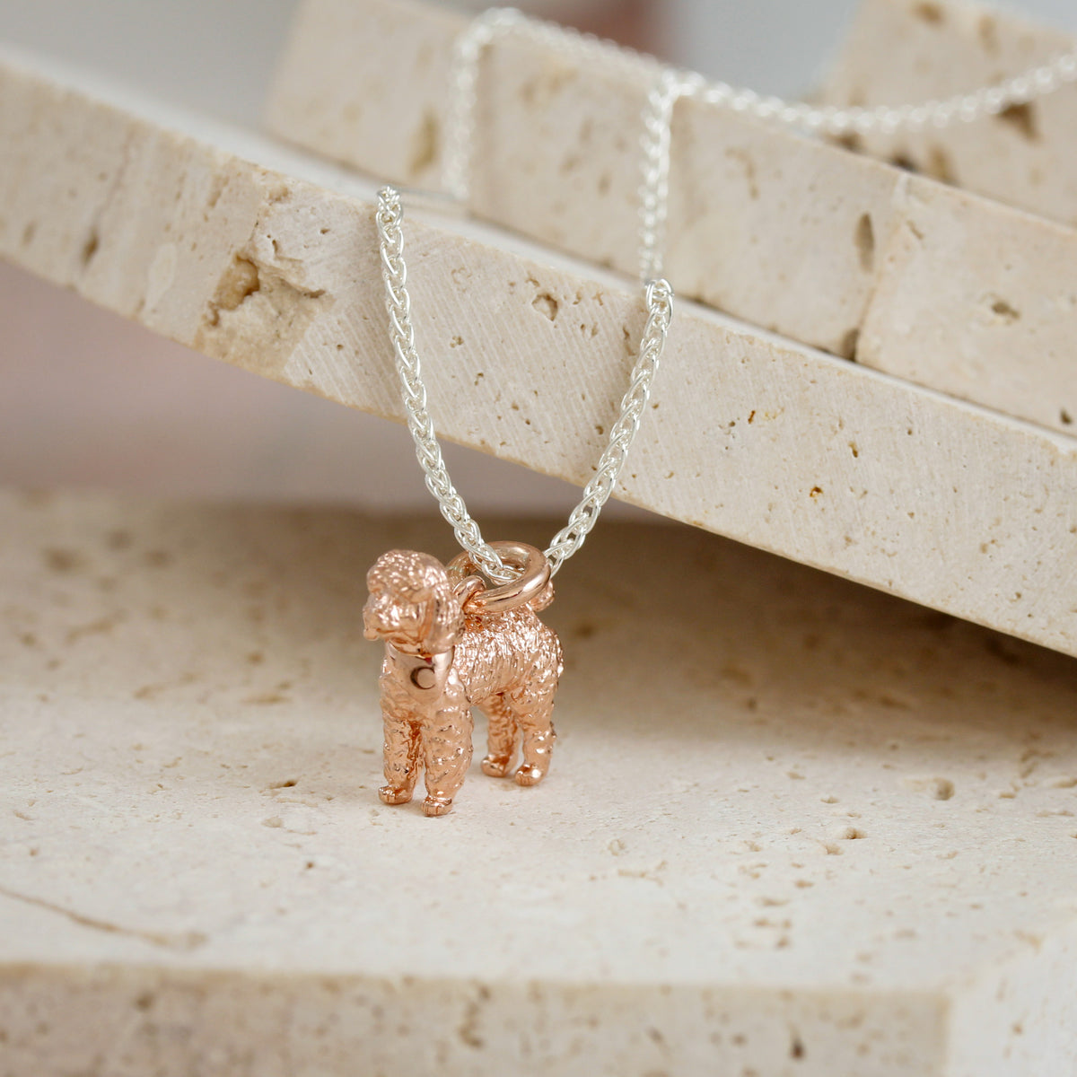 rose gold poodle pendant on silver chain
