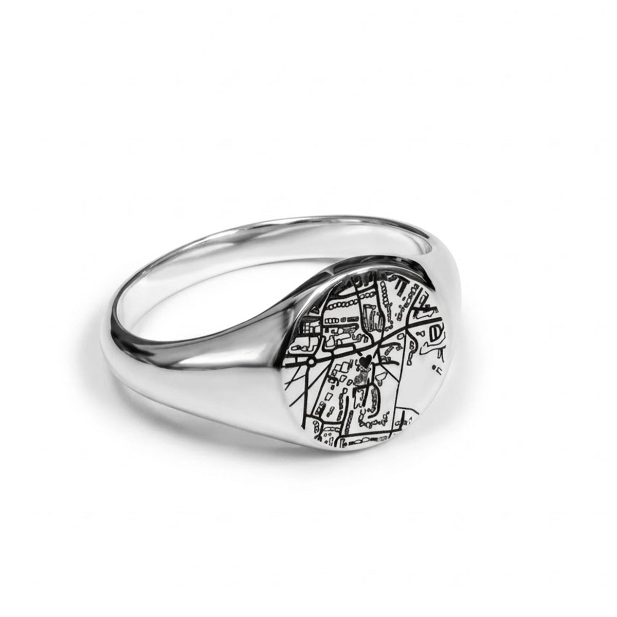 A silver signet ring featuring an engraved black street map design on its round face, shown on a clean white background.