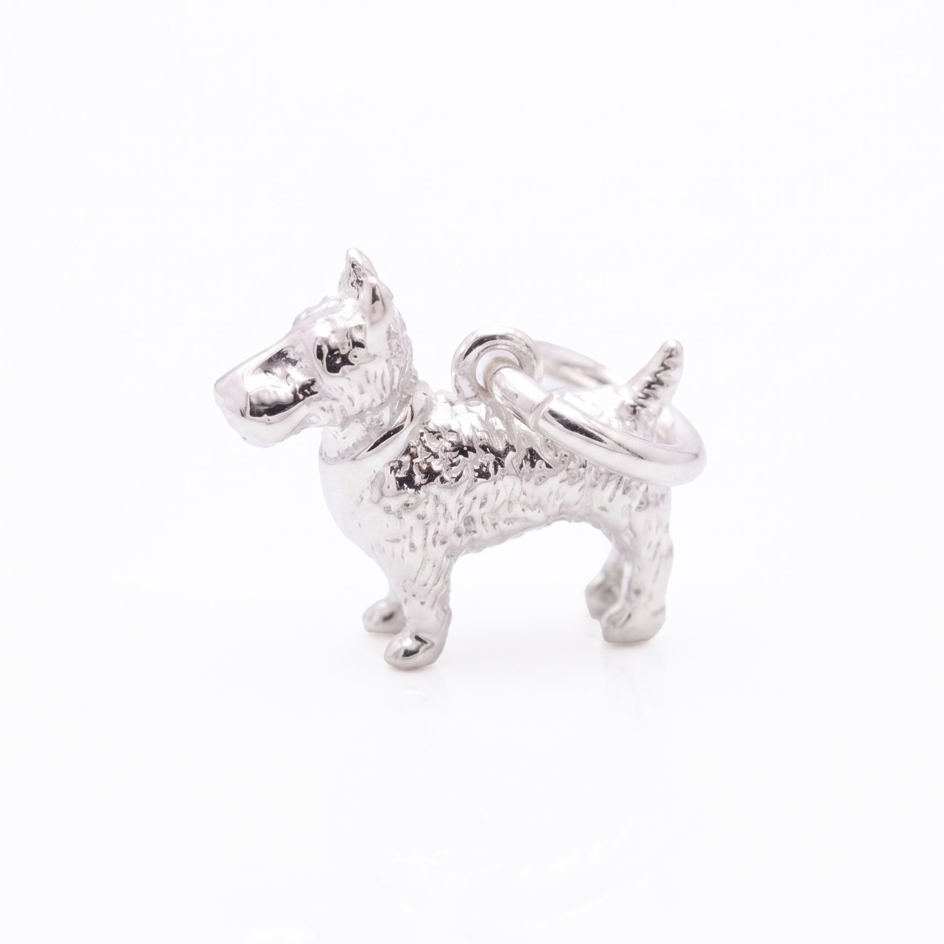 Silver scotty dog charm on a white background