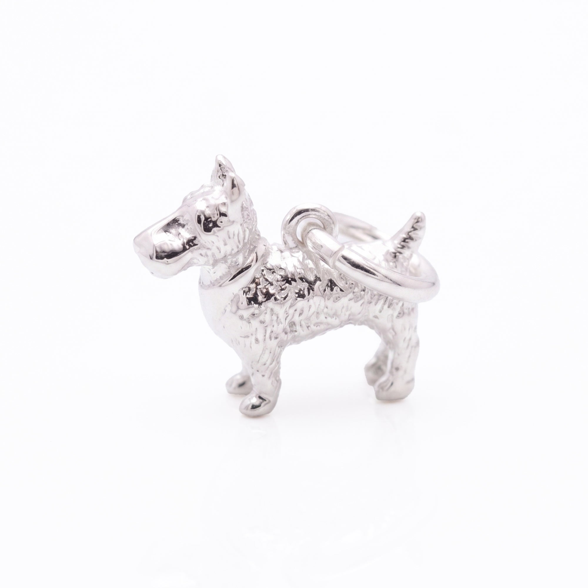 Silver scotty dog charm on a white background