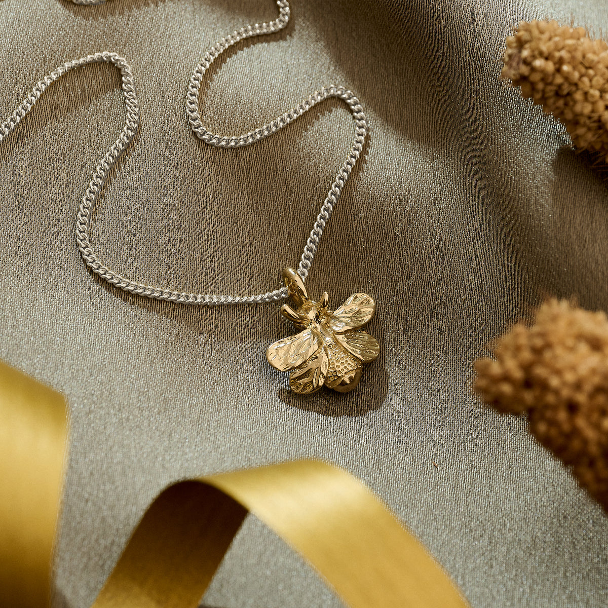 solid gold bee pendant on 2mm silver curb chain
