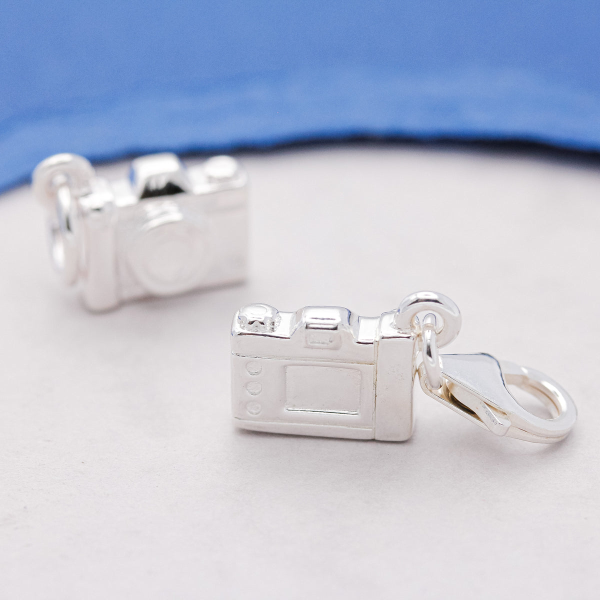 Camera charm with clip-on clasp attachment for bracelet versatility