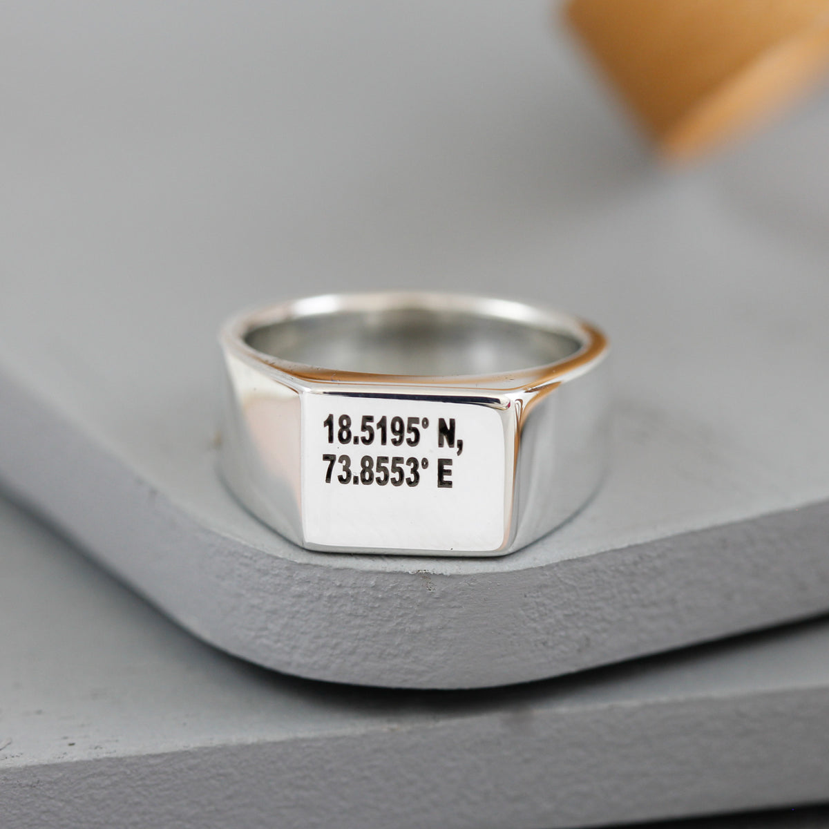 silver signet ring with latitude longitude coordinates engraved