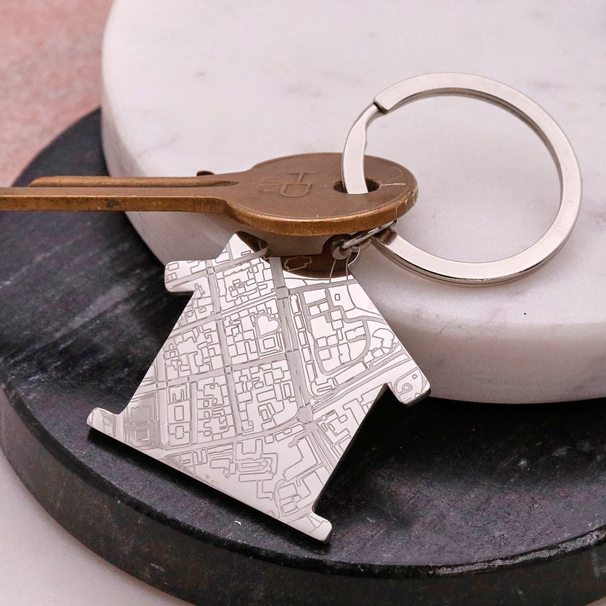 Silver house shaped silver keyring with street map design