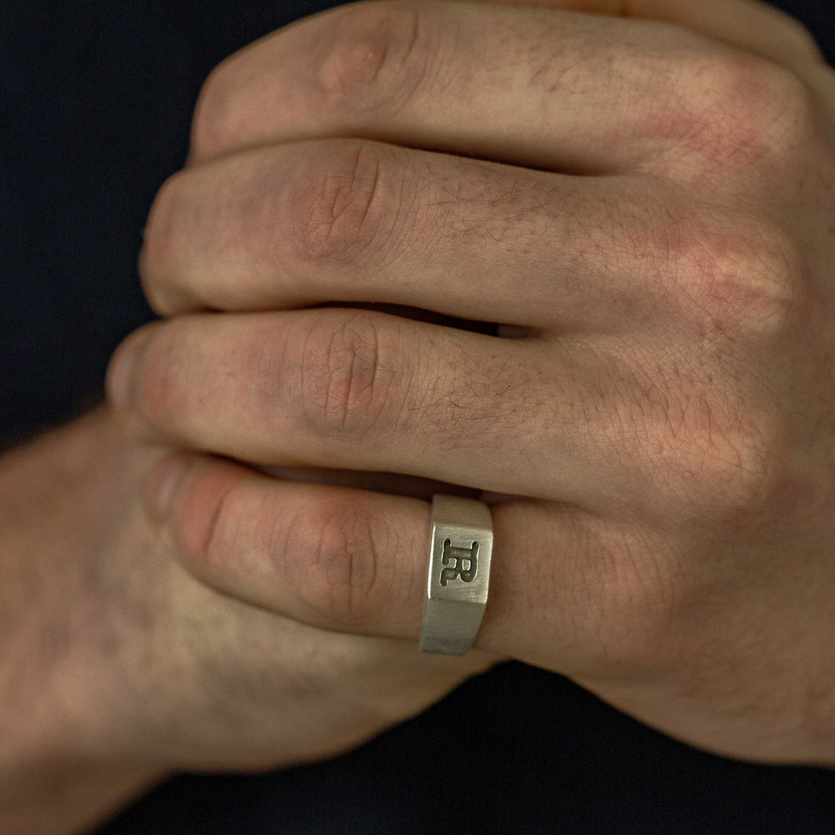 silver signet ring engraved with typewriter initial