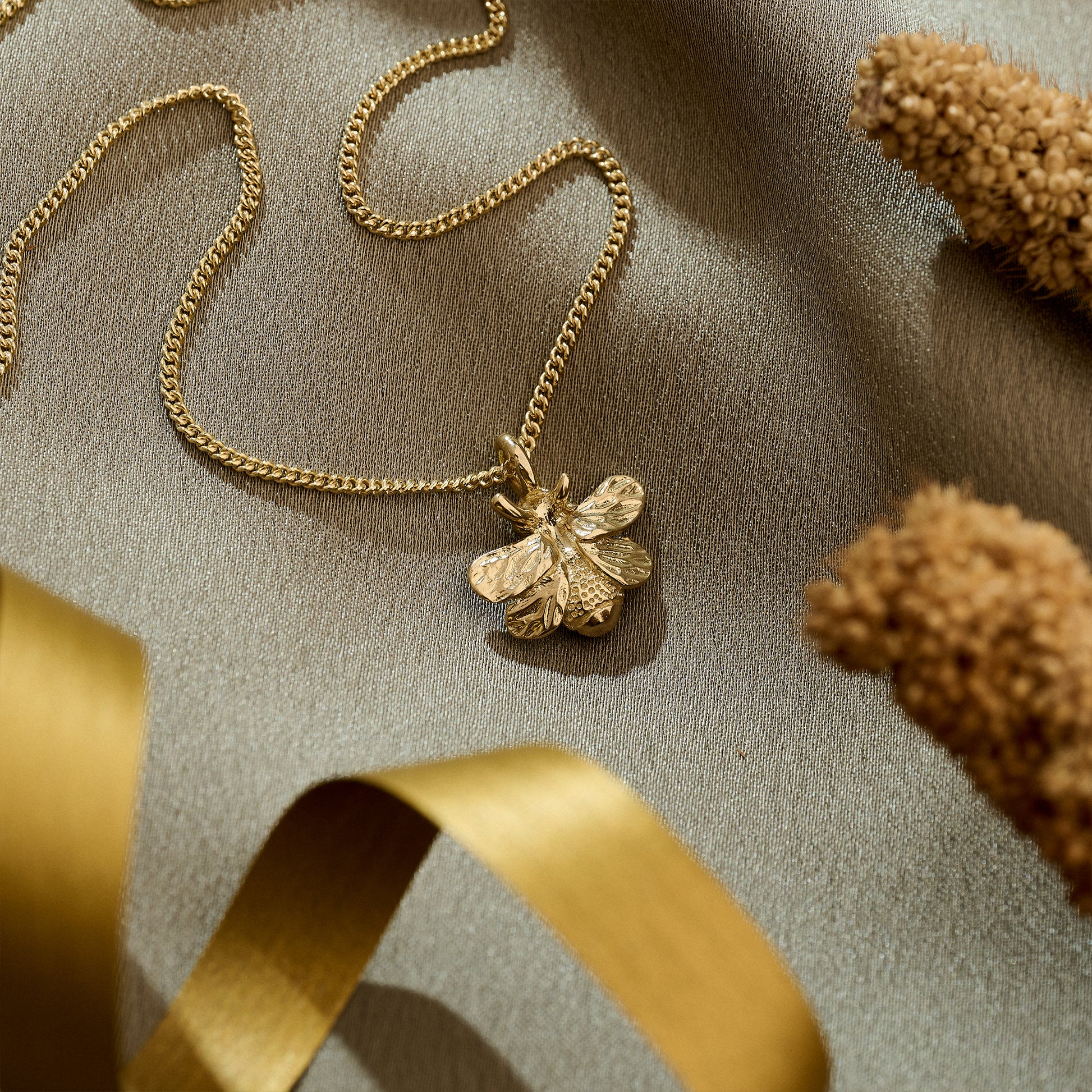 solid gold bumble bee pendant on gold curb chain nature jewellery