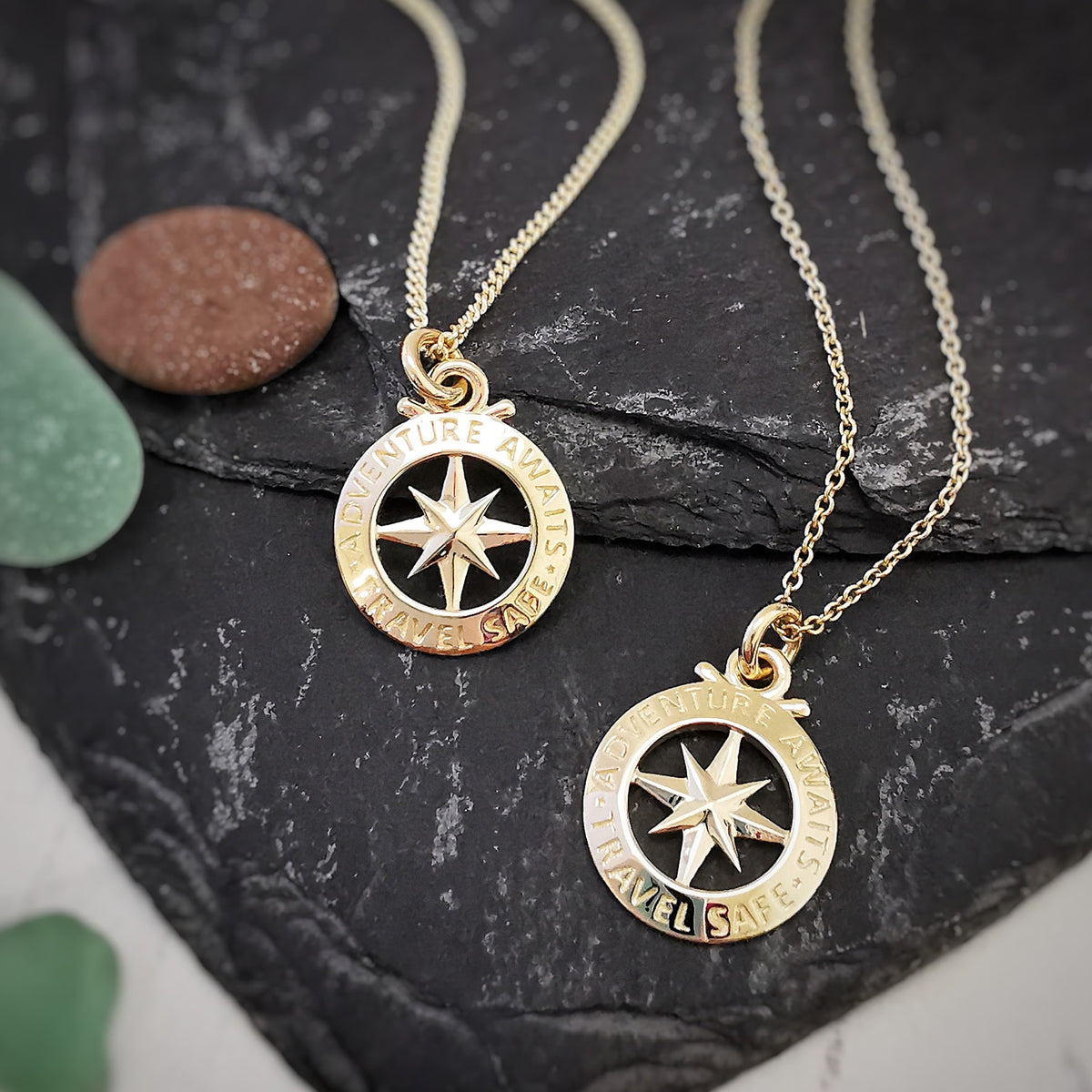 small solid gold compass necklace on curb and trace chains