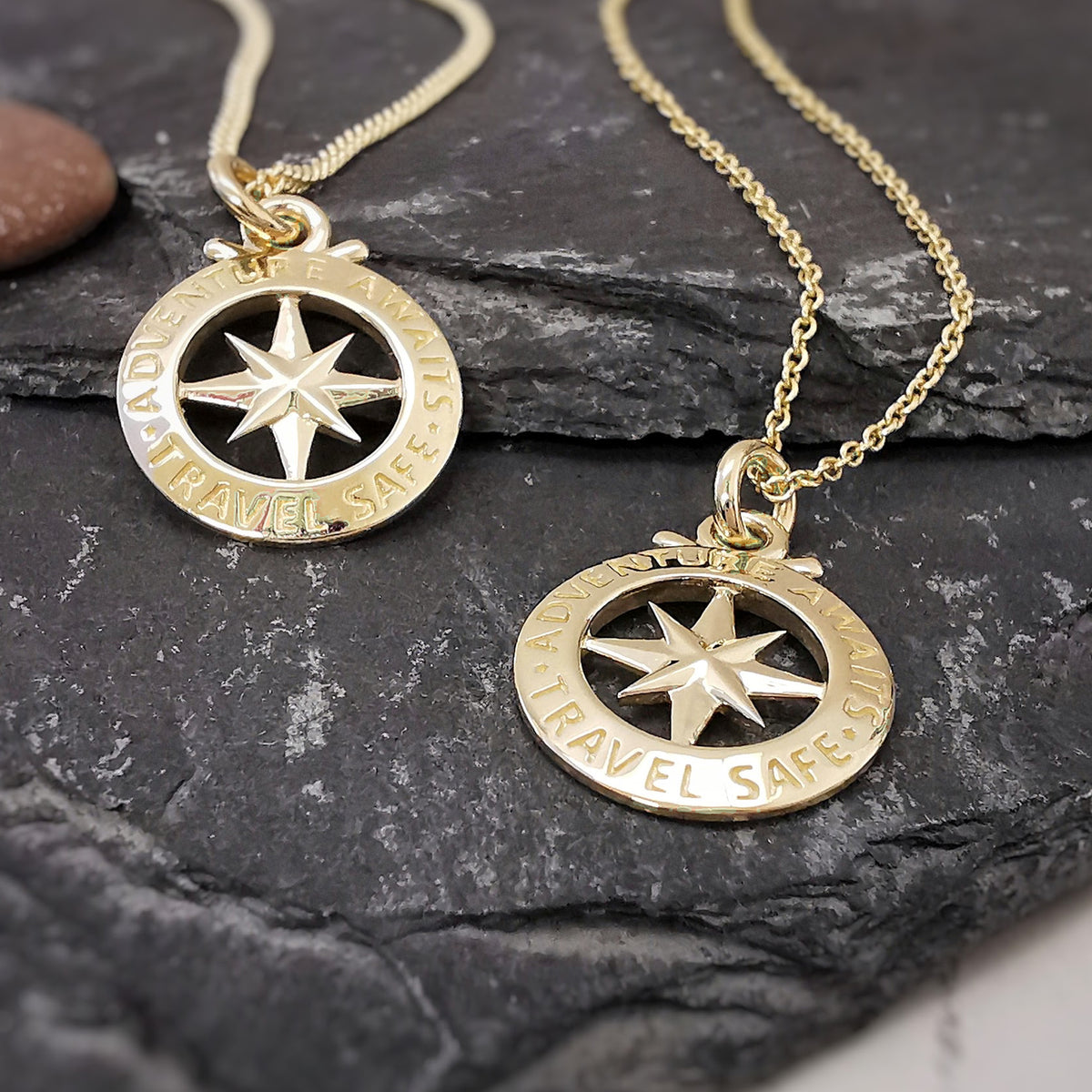 small solid gold compass necklace on curb and trace chains