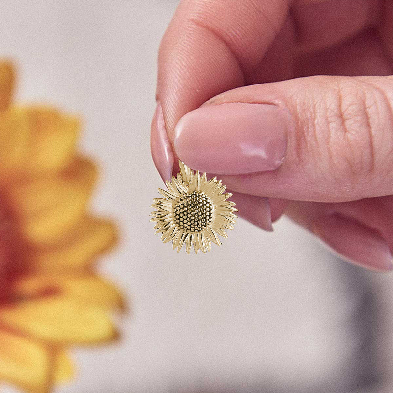 solid gold sunflower charm chelsea flower show award winning stand
