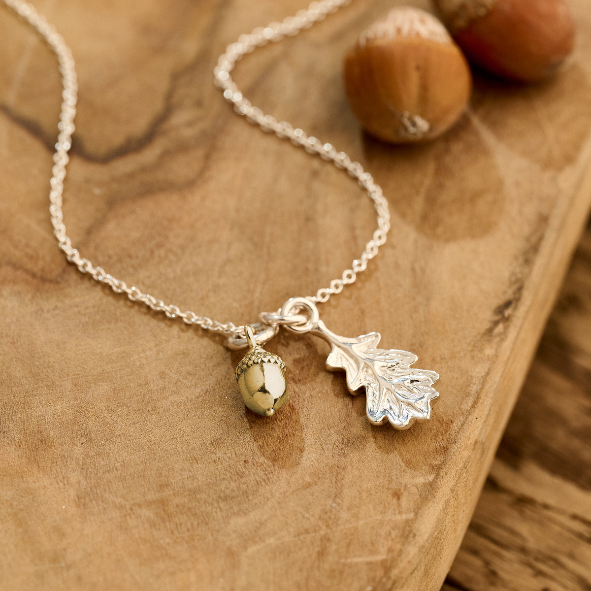 tiny solid gold acorn and silver oak leaf necklace
