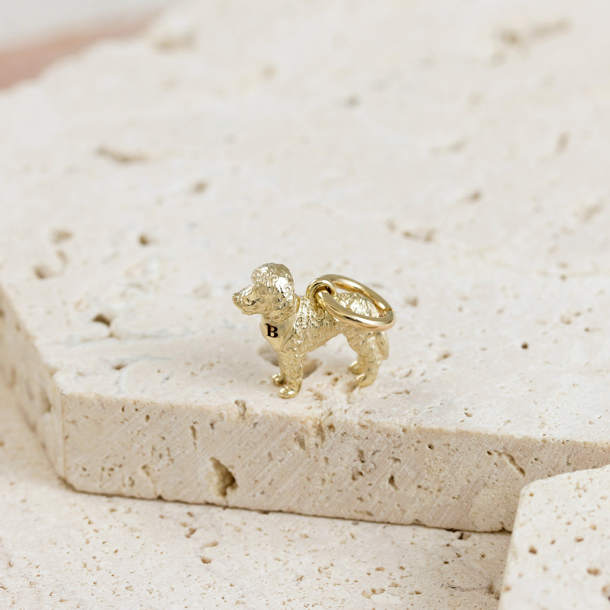 Solid 9ct gold Labradoodle charm with tiny bandana, perfect for a charm bracelet or necklace.