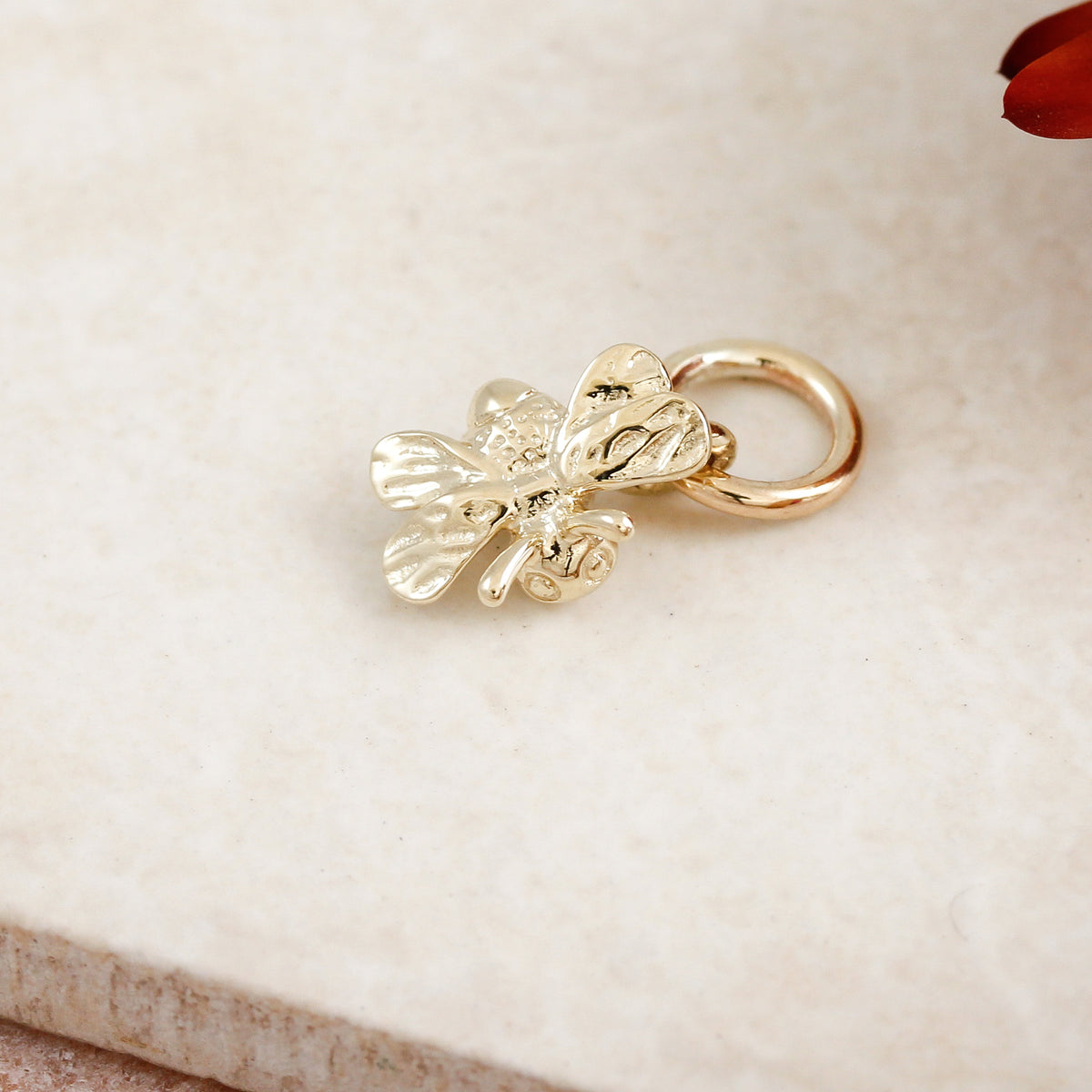 solid gold tiny bumble bee charm