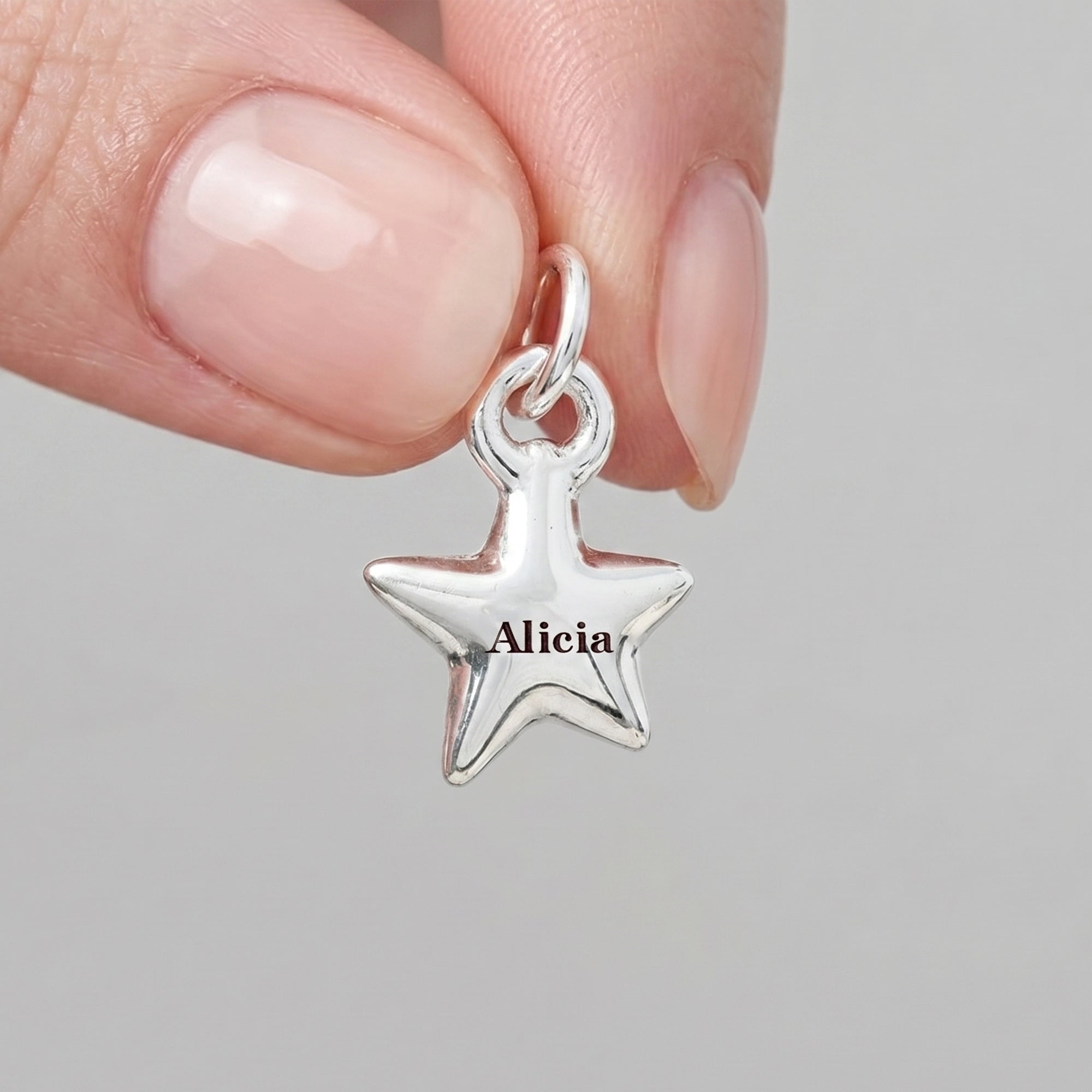 silver star charm engraved with Alicia