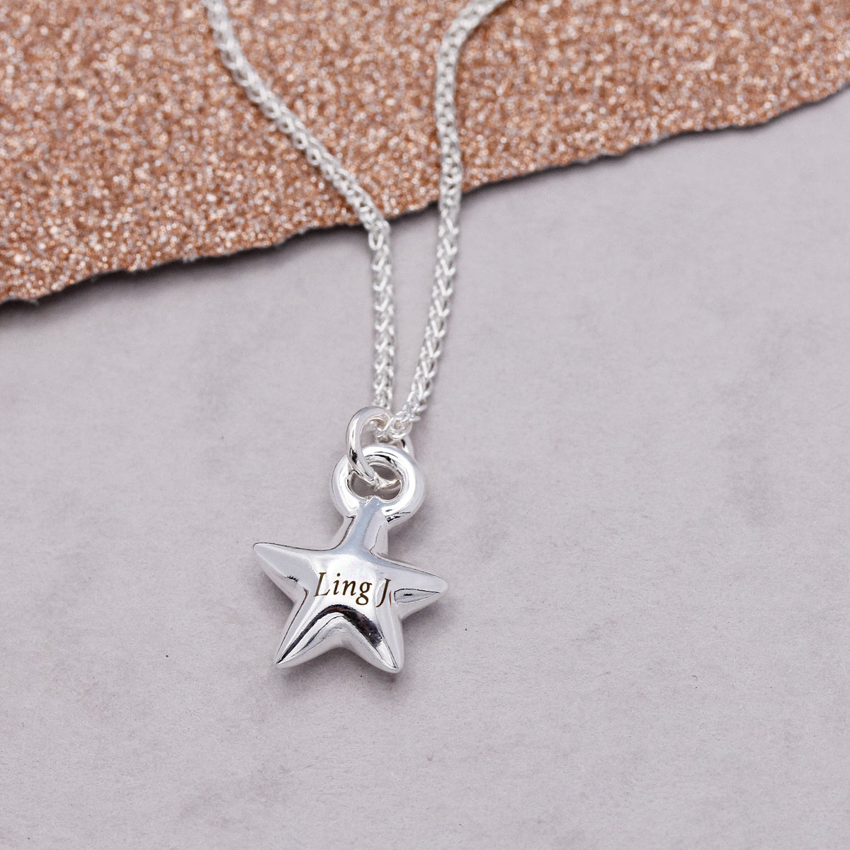 silver star charm necklace with engraved name