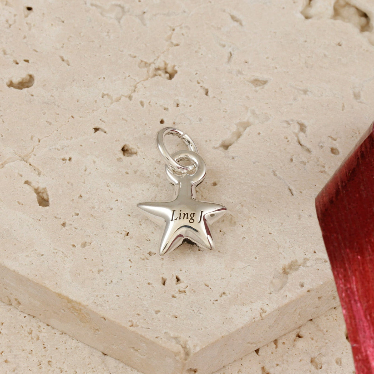 personalised silver star bracelet charm engraved with name