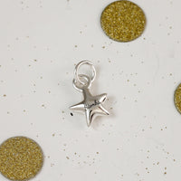 personalised silver star bracelet charm engraved with name