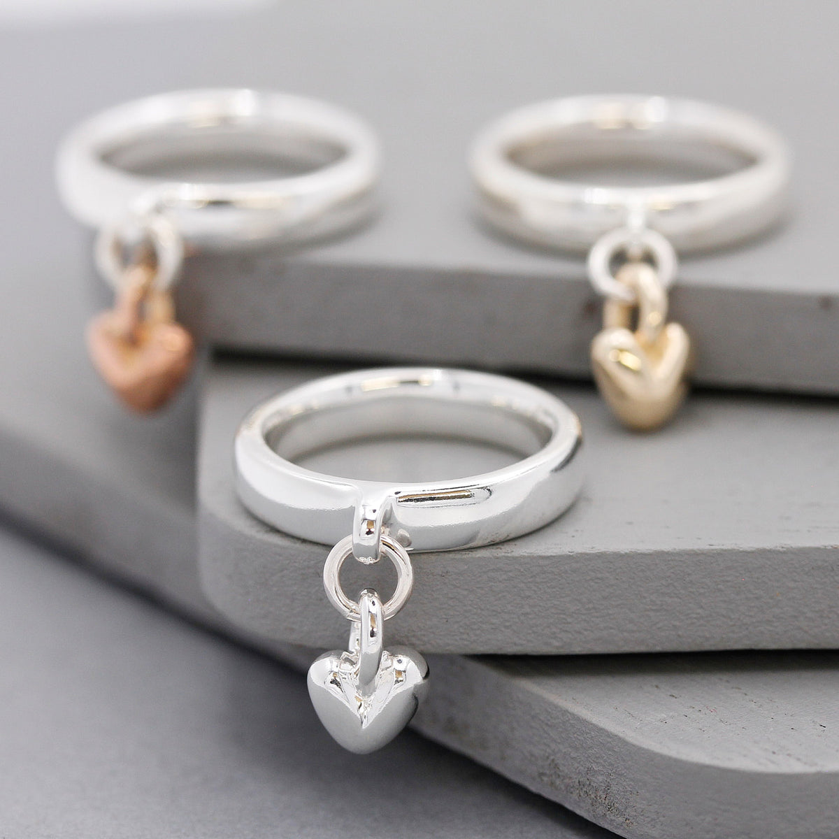 silver dangling heart charm ring