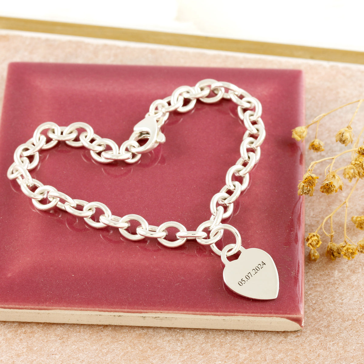 silver starter charm bracelet with birth date engraved on heart