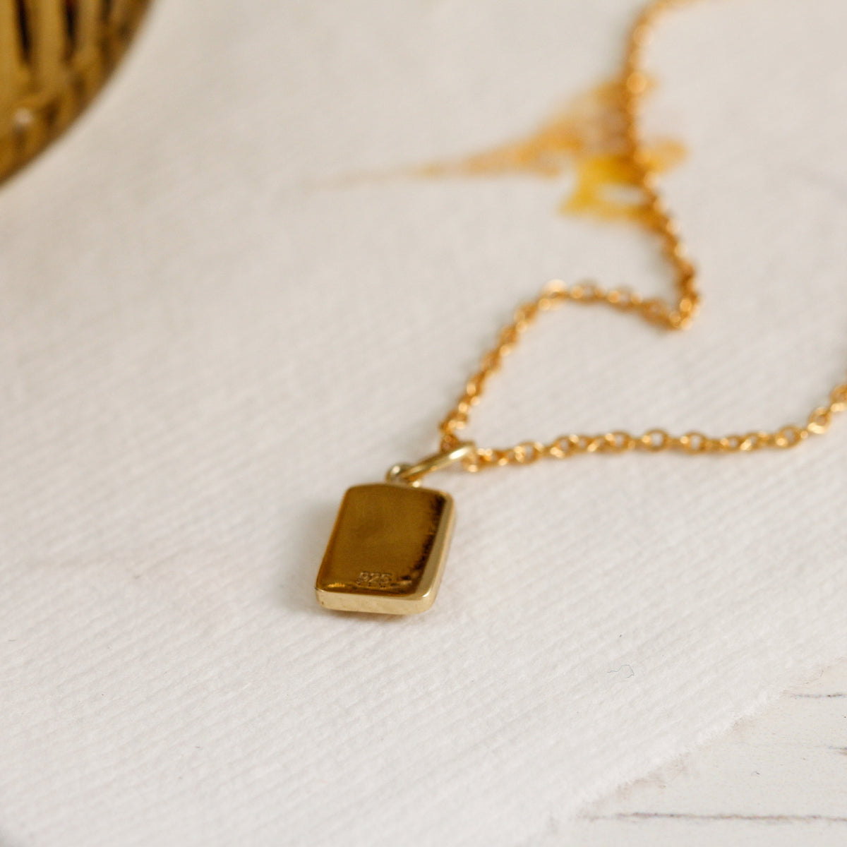tiny gold plated daisy tag necklace