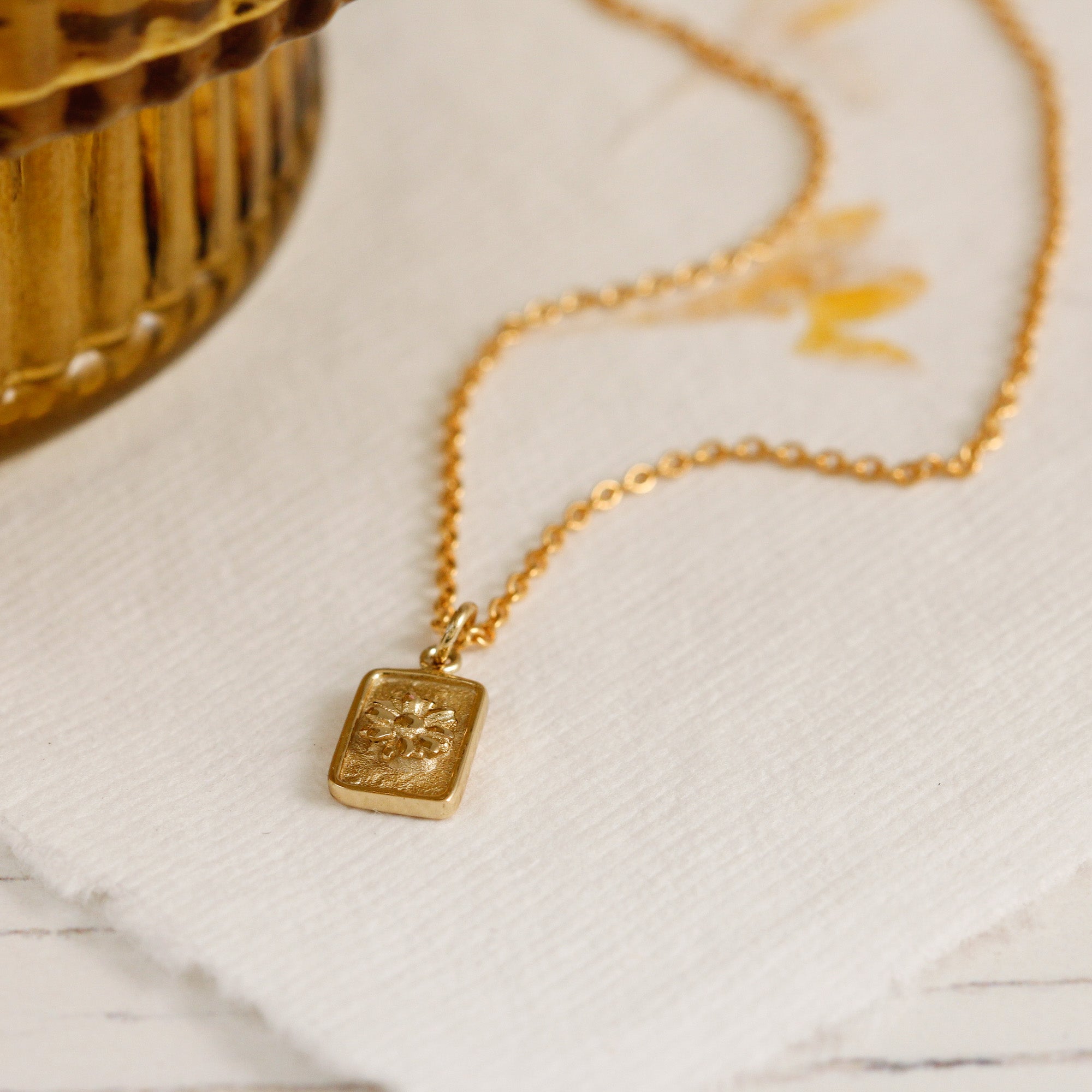 tiny gold plated daisy tag necklace