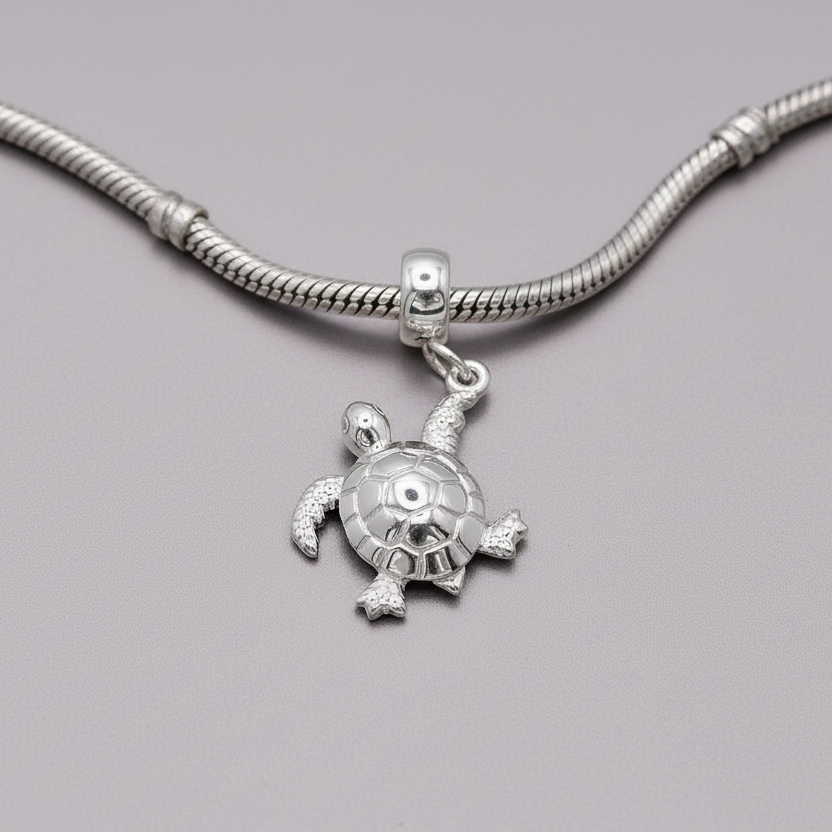 silver turtle charm on charm carrier and snake chain bracelet