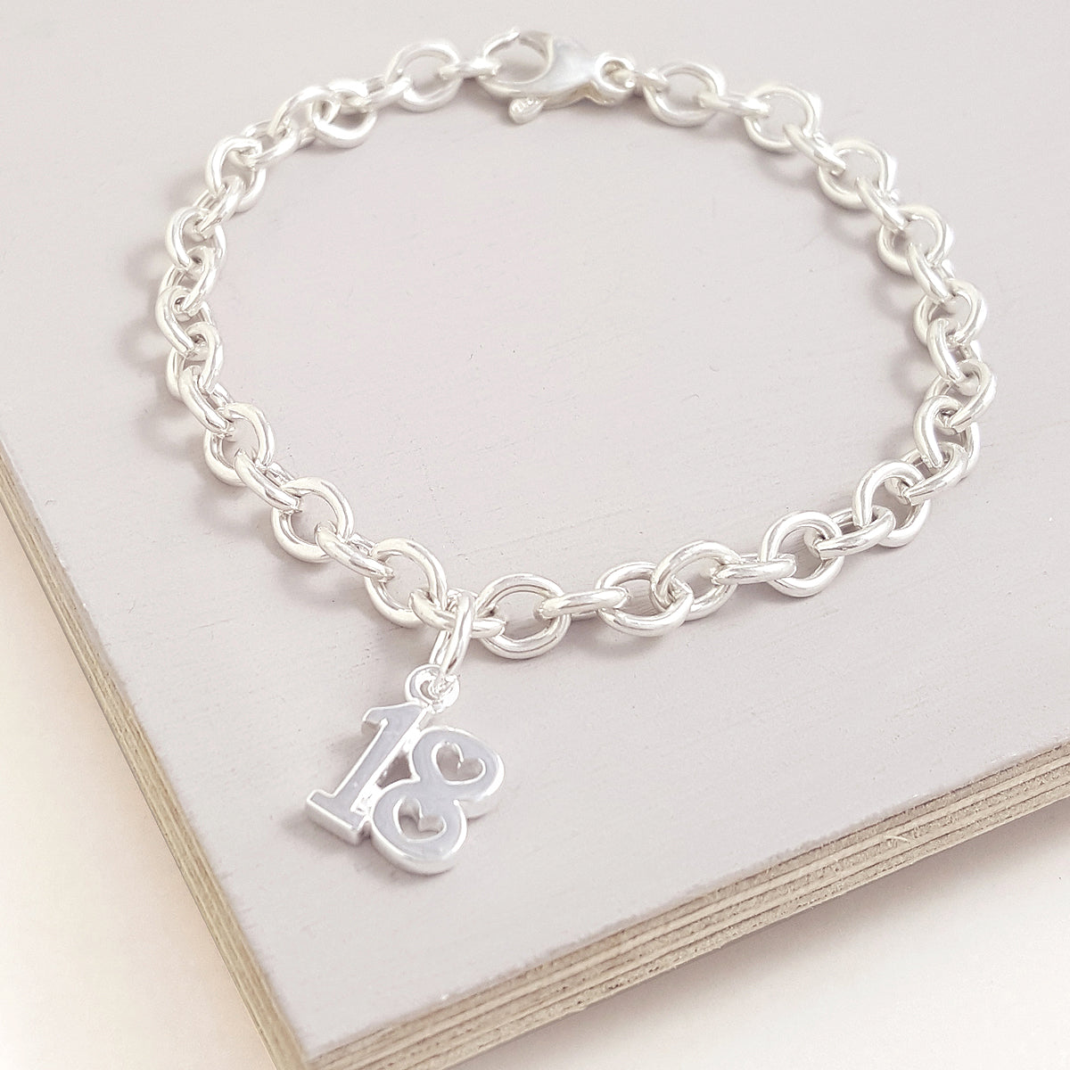 18th birthday charm for bracelet with heart shaped detail