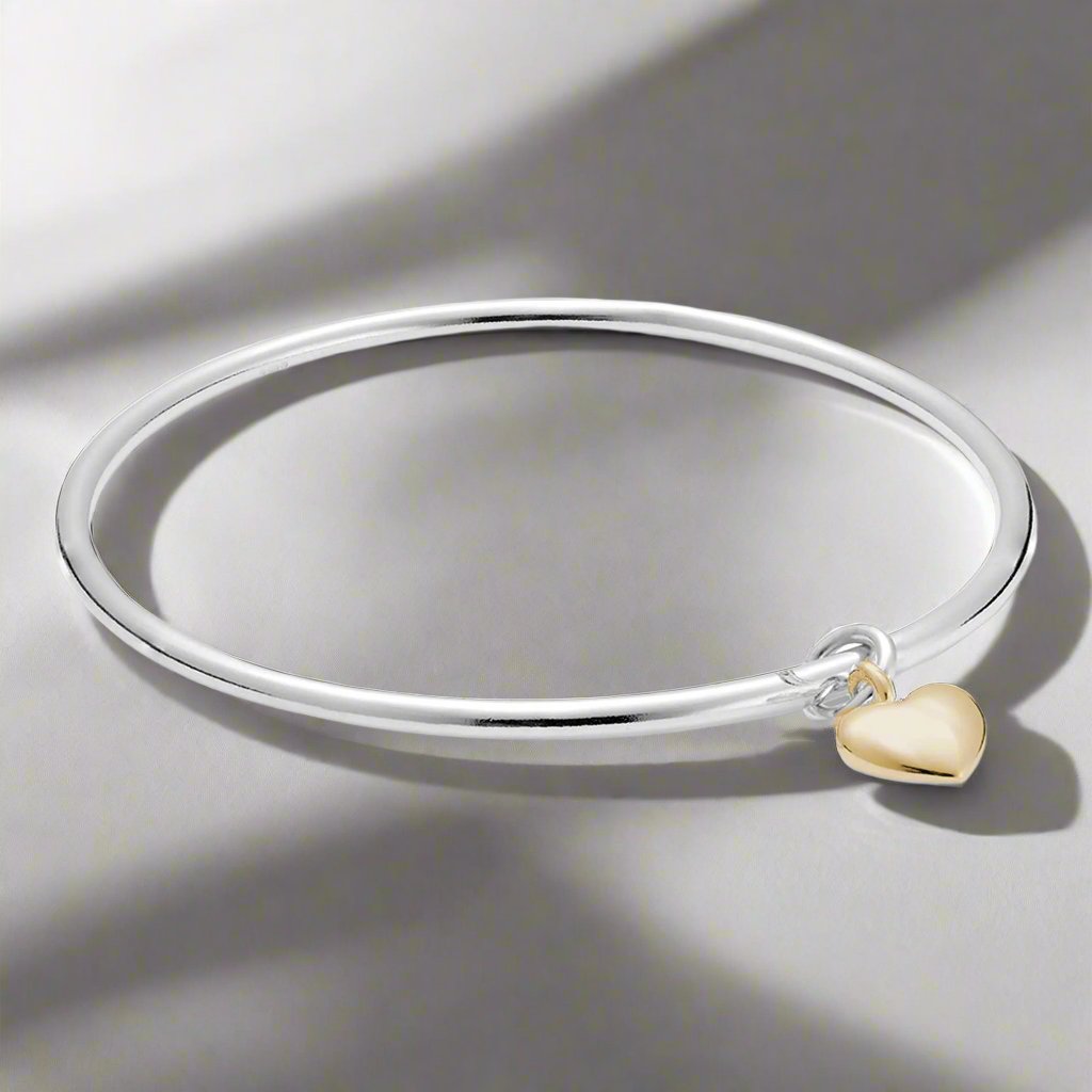 silver and solid gold heart bangle bracelet for women designer jewellery made in UK forever heart
