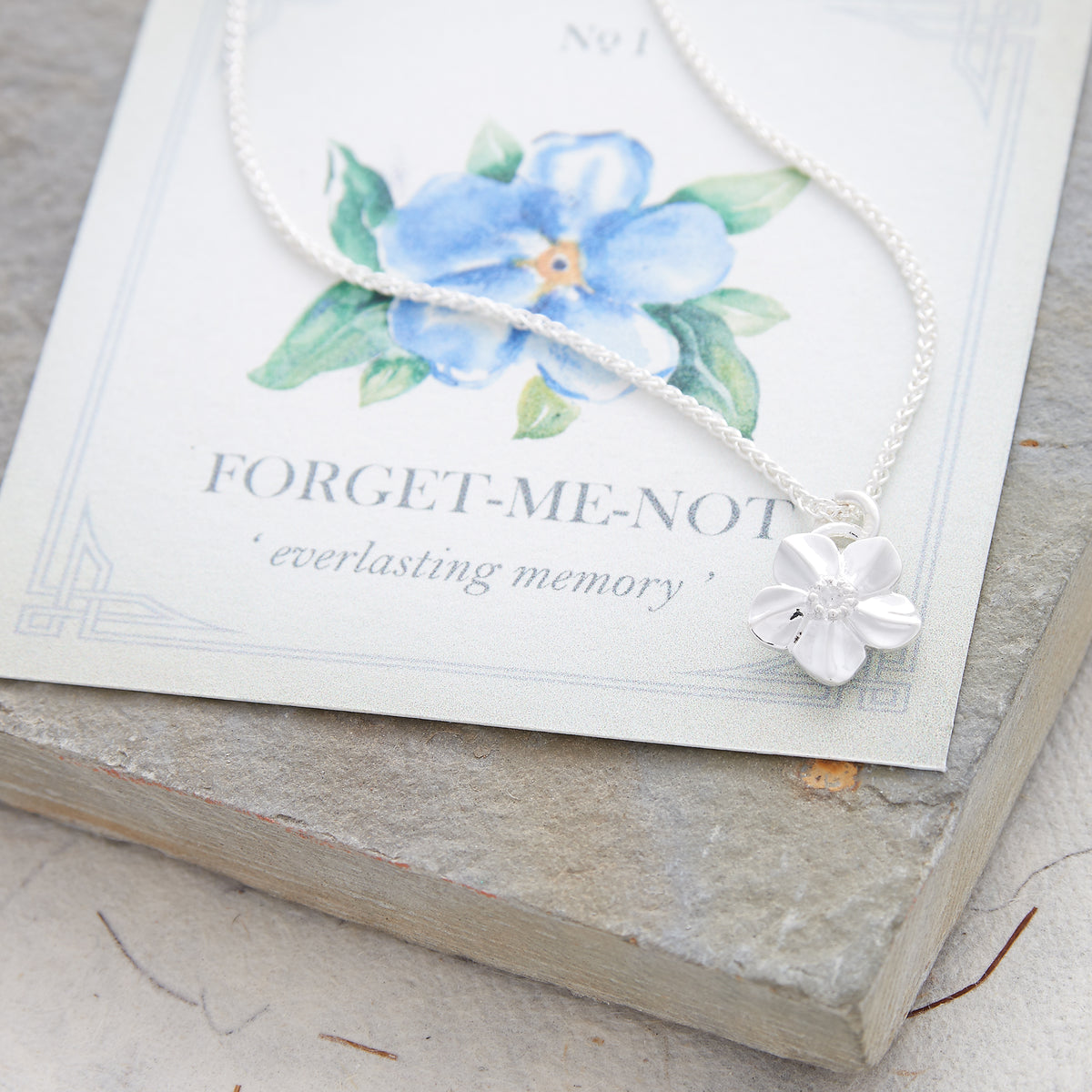 Silver forget-me-not flower necklace with heart on the back memorial gift slow fashion Chelsea Flower Show