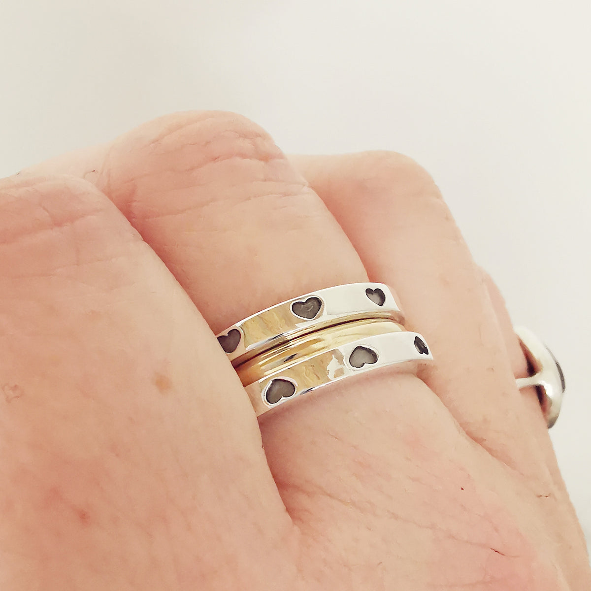 heart stacking rings silver with solid gold central band from Scarlett Jewellery UKsilver heart stacking ring with solid gold middle Scarlett Jewellery Hove UK