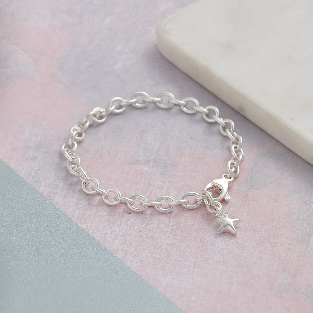 Solid silver adjustable charm bracelet with star Scarlett Jewellery