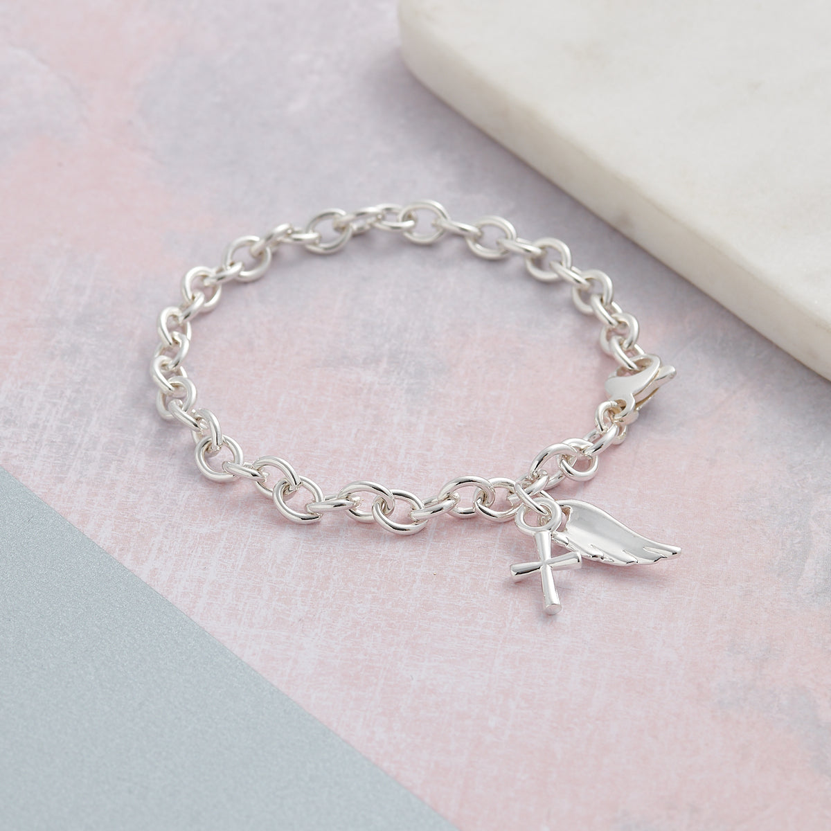 Solid sterling silver angel wing and cross christening charm bracelet designer Scarlett Jewellery
