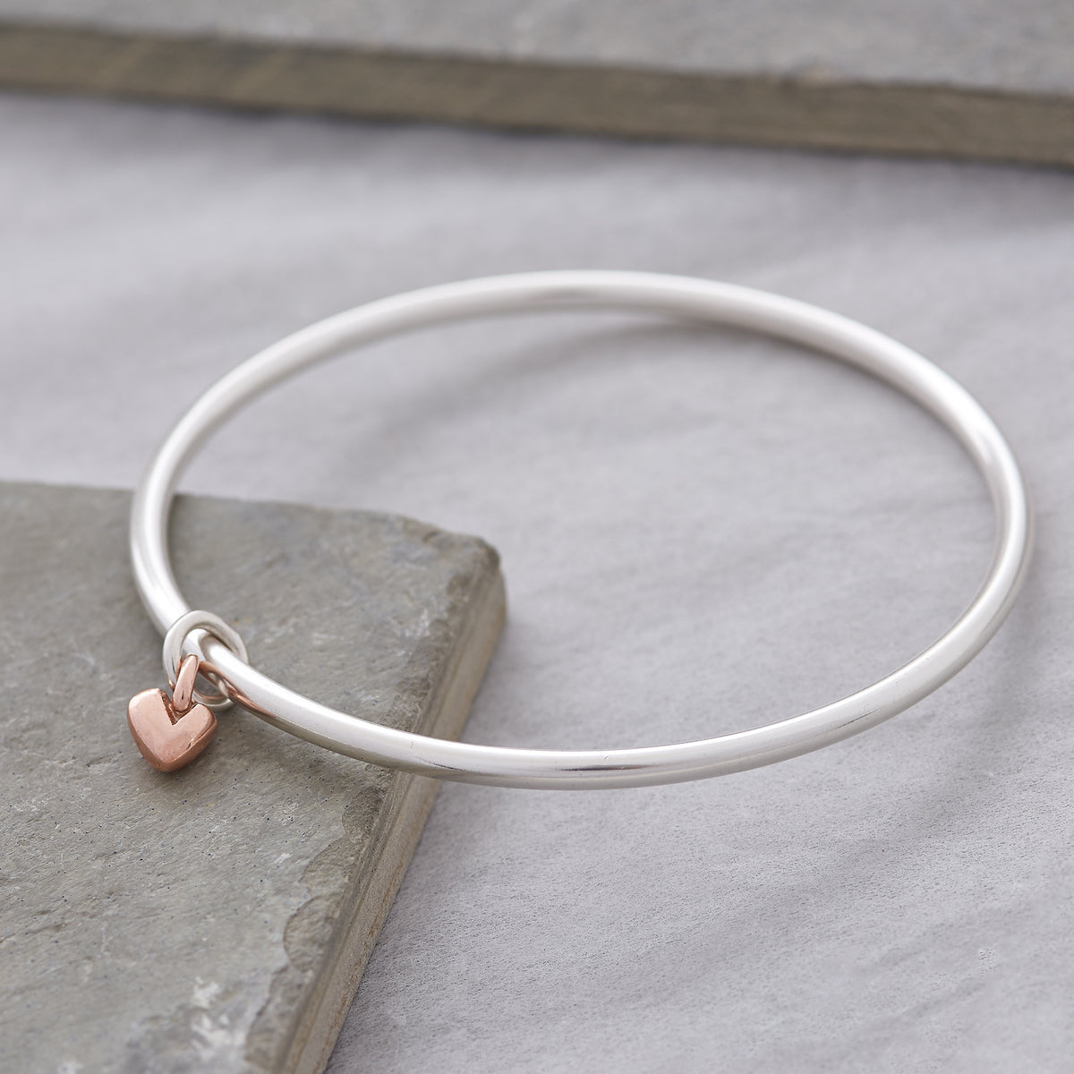 silver bangle with recycled rose gold heart charm made in UK Scarlett Jewellery