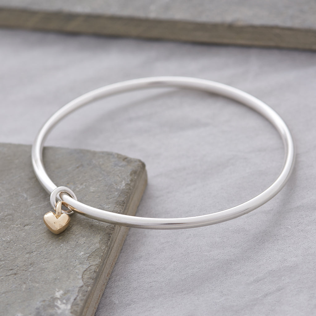 silver bangle with solid recycled 9k yellow gold heart charm scarlett jewellery made in UK