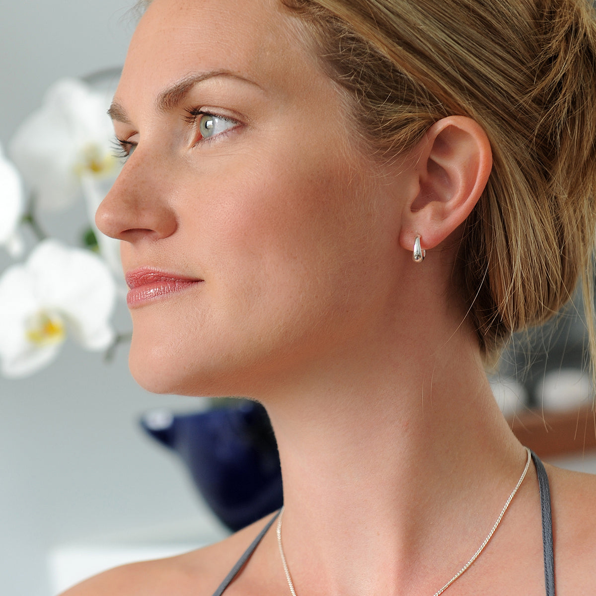 A classic and simple pair of small silver hoops made from recycled sterling silver