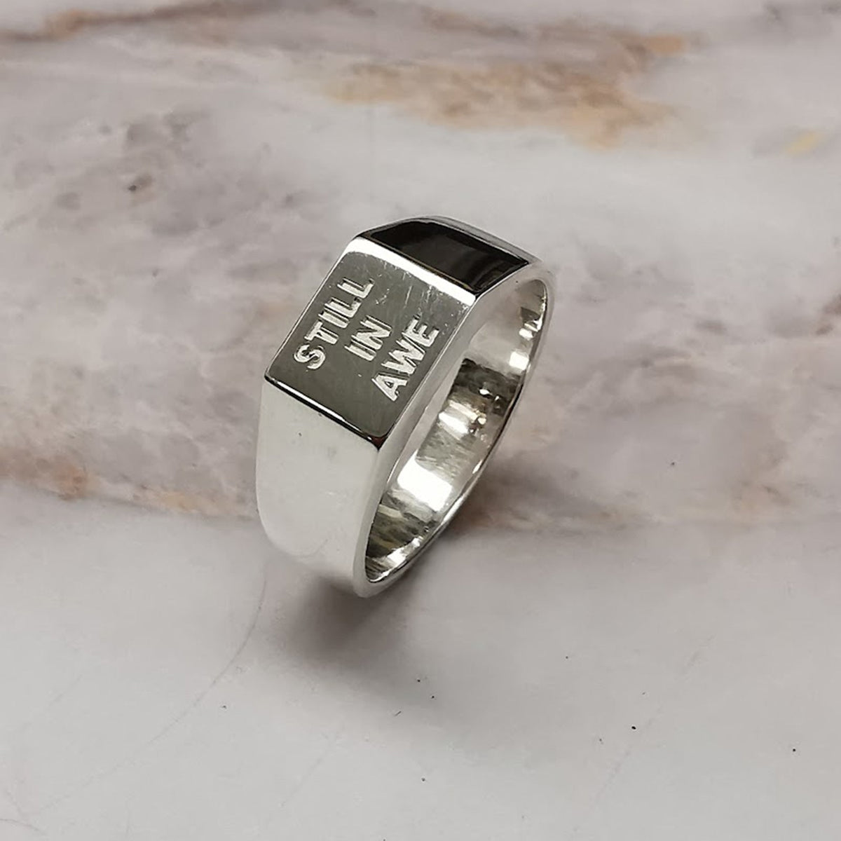 custom engraved silver signet ring engraved with still in awe