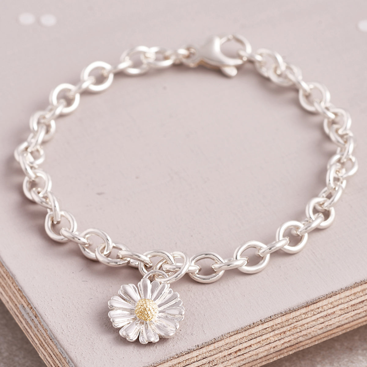 Silver and solid gold daisy charm bracelet flower jewellery UK
